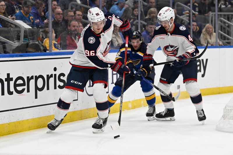 Jan 30, 2024; St. Louis, Missouri, USA; Columbus Blue Jackets center Jack Roslovic (96) controls the puck from the St. Louis Blues during the first period at Enterprise Center. Mandatory Credit: Jeff Le-USA TODAY Sports