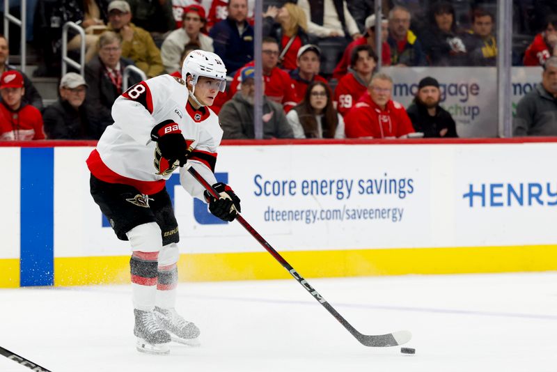 Jan 7, 2025; Detroit, Michigan, USA; Ottawa Senators center Tim Stützle (18) skates with the puck in the third period against the Detroit Red Wings at Little Caesars Arena. Mandatory Credit: Rick Osentoski-Imagn Images