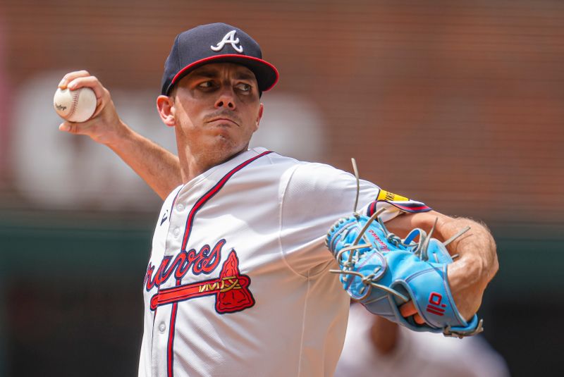 Jul 24, 2024; Cumberland, Georgia, USA; Atlanta Braves starting pitcher Allan Winans (72) pitches against the Cincinnati Reds during the first inning at Truist Park. Mandatory Credit: Dale Zanine-USA TODAY Sports