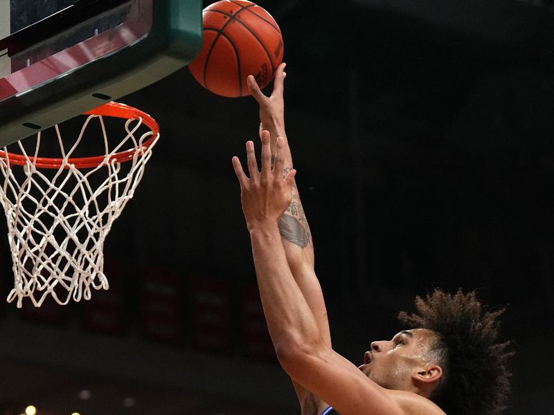 Feb 6, 2023; Coral Gables, Florida, USA; Duke Blue Devils center Dereck Lively II (1) puts up a shot against the Miami Hurricanes during the first half at Watsco Center. Mandatory Credit: Jasen Vinlove-USA TODAY Sports