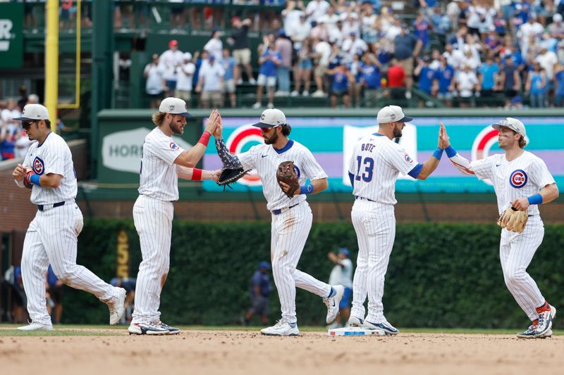 Jul 4, 2024; Chicago, Illinois, USA; Chicago Cubs players celebrate after defeating the Philadelphia Phillies at Wrigley Field. Mandatory Credit: Kamil Krzaczynski-USA TODAY Sports