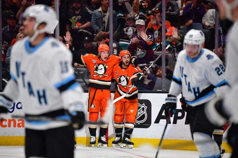 Oct 16, 2024; Anaheim, California, USA; Anaheim Ducks center Robby Fabbri (13) celebrates his goal scored against Utah Hockey Club with center Trevor Zegras (11) during the second period at Honda Center. Zegras provided an assist on the goal. Mandatory Credit: Gary A. Vasquez-Imagn Images