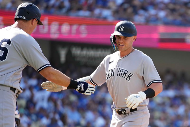 Jun 3, 2023; Los Angeles, California, USA; New York Yankees left fielder Jake Bauers (61) celebrates with third baseman DJ LeMahieu (26) after hitting a two-run home run in the second inning against the Los Angeles Dodgers at Dodger Stadium. Mandatory Credit: Kirby Lee-USA TODAY Sports