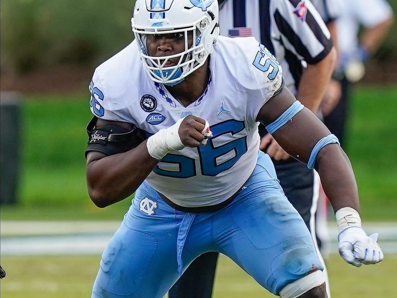 Nov 7, 2020; Durham, North Carolina, USA; North Carolina Tar Heels defensive lineman Tomari Fox (56) tries to move around the end against the Duke Blue Devils during the second half at Wallace Wade Stadium. Mandatory Credit: Jim Dedmon-USA TODAY Sports