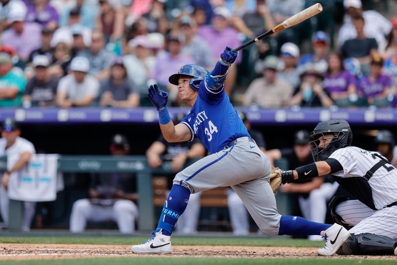 Jul 7, 2024; Denver, Colorado, USA; Kansas City Royals catcher Freddy Fermin (34) hits a sacrifice fly RBI in the eighth inning against the Colorado Rockies at Coors Field. Mandatory Credit: Isaiah J. Downing-USA TODAY Sports