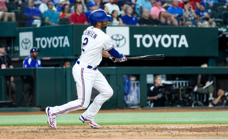 Aug 16, 2023; Arlington, Texas, USA;  Texas Rangers second baseman Marcus Semien (2) doubles during the eighth inning to break up a no hitter against the Los Angeles Angels at Globe Life Field. Mandatory Credit: Kevin Jairaj-USA TODAY Sports