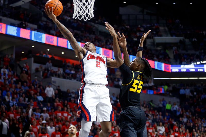 Feb 17, 2024; Oxford, Mississippi, USA; Mississippi Rebels guard TJ Caldwell (2) shoots as Missouri Tigers guard Sean East II (55) defends during the second half at The Sandy and John Black Pavilion at Ole Miss. Mandatory Credit: Petre Thomas-USA TODAY Sports