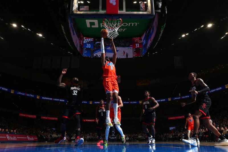 OKLAHOMA CITY, OK - MARCH 27:  Jalen Williams #8 of the Oklahoma City Thunder grabs a rebound during the game against the Houston Rockets on March 27, 2024 at Paycom Arena in Oklahoma City, Oklahoma. NOTE TO USER: User expressly acknowledges and agrees that, by downloading and or using this photograph, User is consenting to the terms and conditions of the Getty Images License Agreement. Mandatory Copyright Notice: Copyright 2024 NBAE (Photo by Zach Beeker/NBAE via Getty Images)