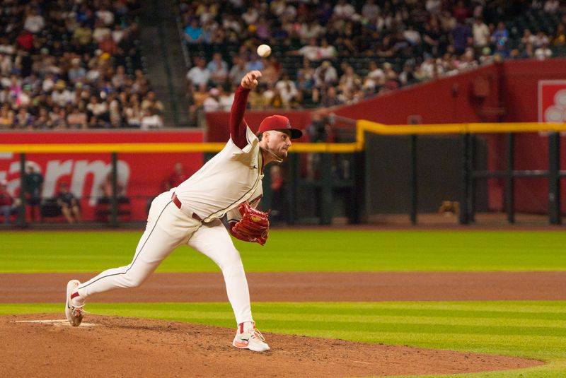 Aug 5, 2025; Phoenix, Arizona, USA; Arizona Diamondbacks pitcher Ryne Nelson (19) pitches in the fourth inning against the San Diego Padres at Chase Field. Mandatory Credit: Allan Henry-Imagn Images