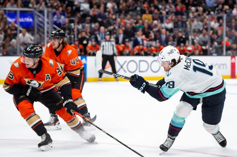 Oct 12, 2022; Anaheim, California, USA; Seattle Kraken left wing Jared McCann (19) shoots the puck against Anaheim Ducks during the third period at Honda Center. Mandatory Credit: Jonathan Hui-USA TODAY Sports