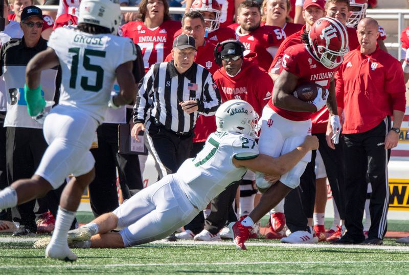 Oct 16, 2021; Bloomington, Indiana, USA; Indiana Hoosiers running back Stephen Carr (5) is tackled by Michigan State Spartans linebacker Cal Haladay (27) during the second quarter at Memorial Stadium. Mandatory Credit: Marc Lebryk-USA TODAY Sports