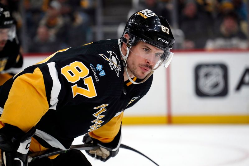 Feb 18, 2024; Pittsburgh, Pennsylvania, USA;  Pittsburgh Penguins center Sidney Crosby (87) looks on before a face-off against the Los Angeles Kings during the third period at PPG Paints Arena.  Los Angeles won 2-1. Mandatory Credit: Charles LeClaire-USA TODAY Sports