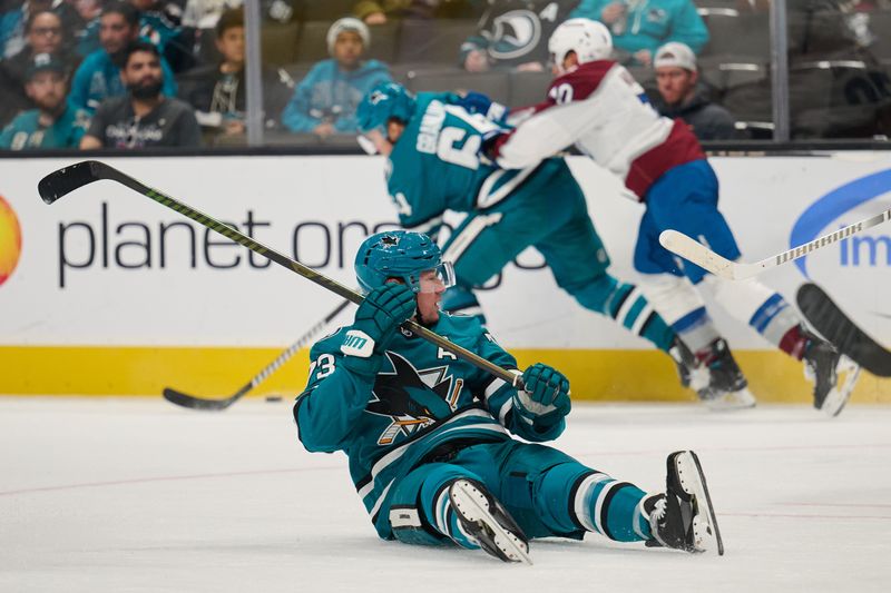 Oct 20, 2024; San Jose, California, USA; San Jose Sharks center Tyler Toffoli (73) sits on the ice and watches the play against the Colorado Avalanche during the second period at SAP Center at San Jose. Mandatory Credit: Robert Edwards-Imagn Images