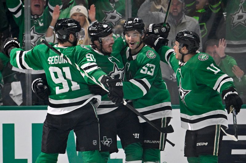 May 1, 2024; Dallas, Texas, USA; Dallas Stars center Tyler Seguin (91) and center Matt Duchene (95) and center Wyatt Johnston (53) and center Logan Stankoven (11) celebrates a power play goal scored by Duchene against the Vegas Golden Knights during the first period in game five of the first round of the 2024 Stanley Cup Playoffs at the American Airlines Center. Mandatory Credit: Jerome Miron-USA TODAY Sports