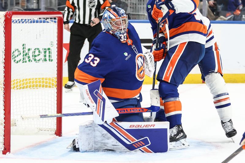 Oct 16, 2025; Elmont, New York, USA; New York Islanders goaltender David Rittich (33) defends the net in the third period against the Edmonton Oilers at UBS Arena. Mandatory Credit: Wendell Cruz-Imagn Images