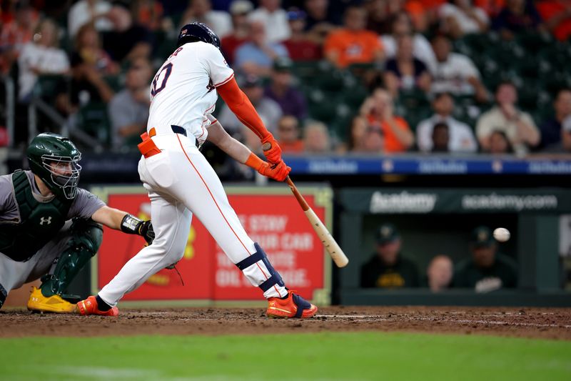 Sep 12, 2024; Houston, Texas, USA; Houston Astros designated hitter Kyle Tucker (30) hits a single to left field against the Oakland Athletics during the eighth inning at Minute Maid Park. Mandatory Credit: Erik Williams-Imagn Images