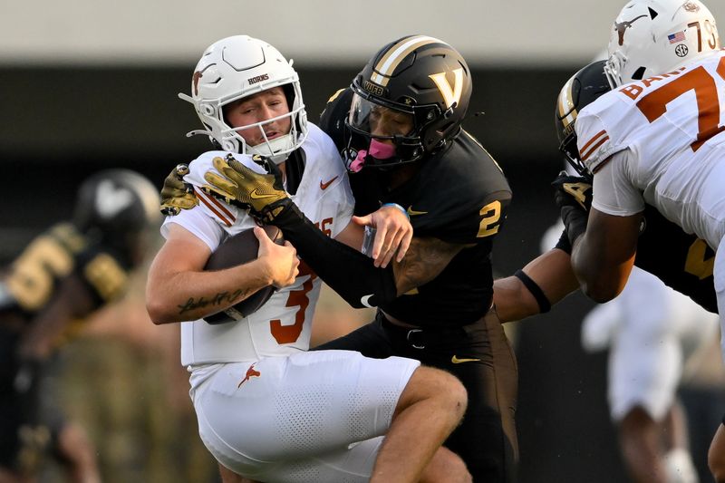 Oct 26, 2024; Nashville, Tennessee, USA;  Vanderbilt Commodores linebacker Randon Fontenette (2) sacks Texas Longhorns quarterback Quinn Ewers (3) during the first half at FirstBank Stadium. Mandatory Credit: Steve Roberts-Imagn Images