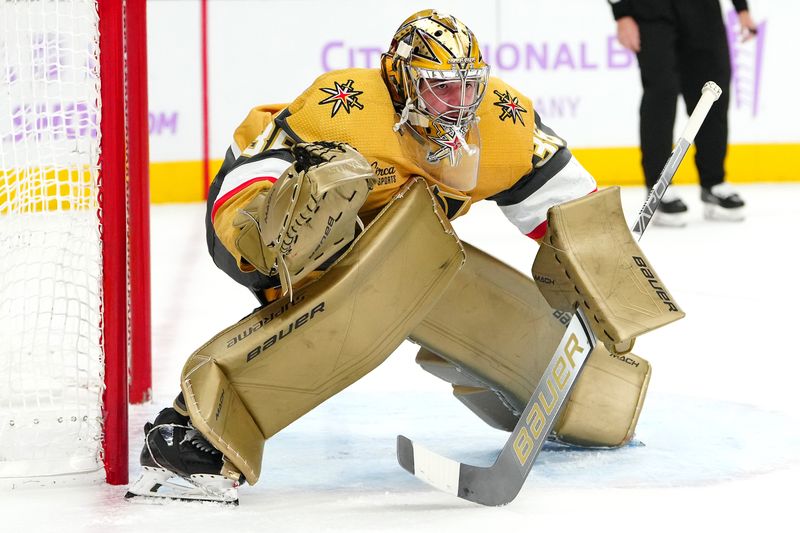 Nov 25, 2023; Las Vegas, Nevada, USA; Vegas Golden Knights goaltender Logan Thompson (36) defends his net against the Arizona Coyotes during the second period at T-Mobile Arena. Mandatory Credit: Stephen R. Sylvanie-USA TODAY Sports