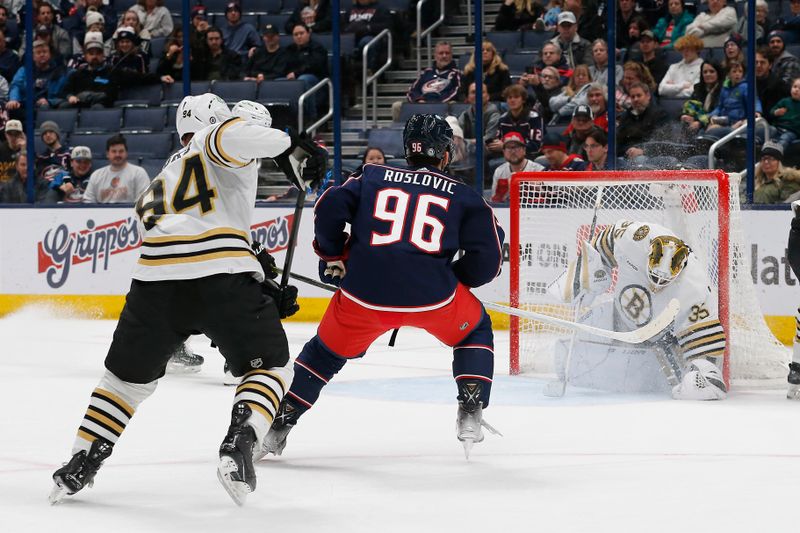 Jan 2, 2024; Columbus, Ohio, USA; Boston Bruins goalie Linus Ullmark (35) makes a save on the shot attempt of Columbus Blue Jackets center Jack Roslovic (96) during the third period at Nationwide Arena. Mandatory Credit: Russell LaBounty-USA TODAY Sports