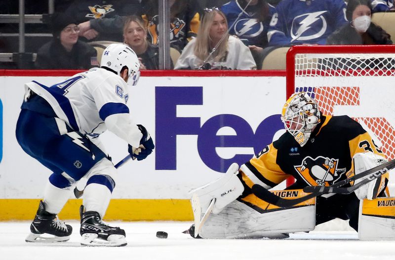 Apr 6, 2024; Pittsburgh, Pennsylvania, USA;  Pittsburgh Penguins goaltender Alex Nedeljkovic (39) makes a save against Tampa Bay Lightning center Tyler Motte (64) during the third period at PPG Paints Arena. The Penguins won 5-4. Mandatory Credit: Charles LeClaire-USA TODAY Sports