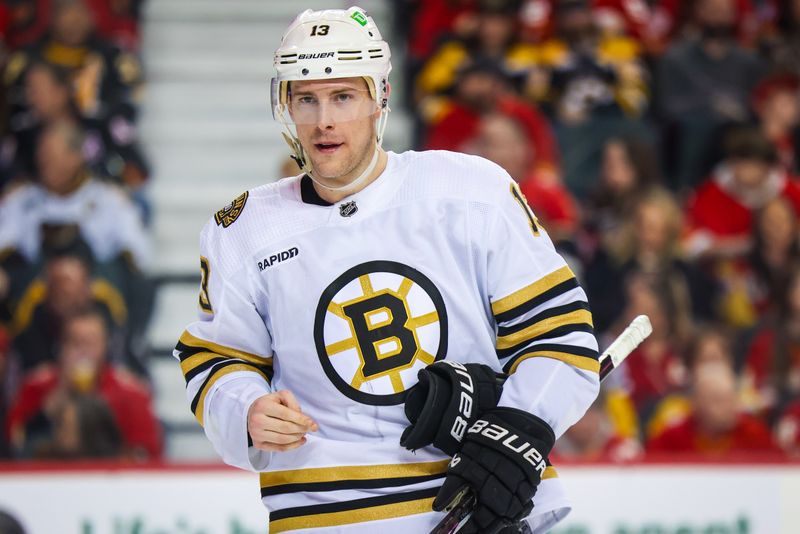 Feb 22, 2024; Calgary, Alberta, CAN; Boston Bruins center Charlie Coyle (13) against the Calgary Flames during the overtime period at Scotiabank Saddledome. Mandatory Credit: Sergei Belski-USA TODAY Sports