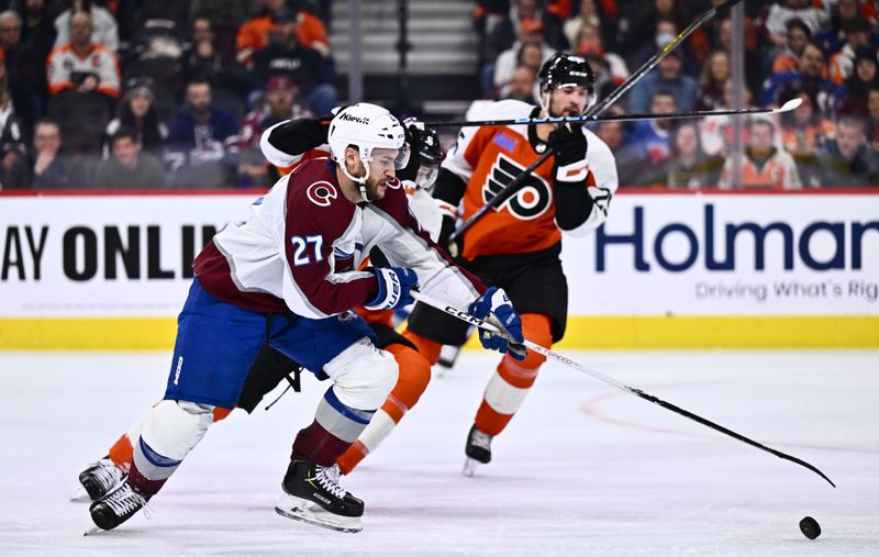 Jan 20, 2024; Philadelphia, Pennsylvania, USA; Colorado Avalanche left wing Jonathan Drouin (27) reaches for the puck against the Philadelphia Flyers in the third period at Wells Fargo Center. Mandatory Credit: Kyle Ross-USA TODAY Sports