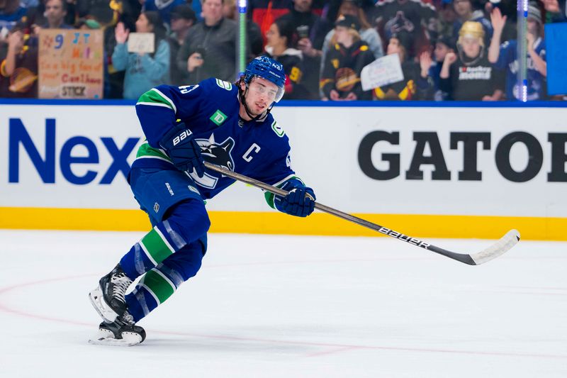 Feb 17, 2024; Vancouver, British Columbia, CAN; Vancouver Canucks defenseman Quinn Hughes (43) skates during warm up prior to a game against the Winnipeg Jets at Rogers Arena. Mandatory Credit: Bob Frid-USA TODAY Sports