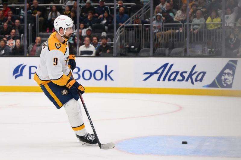 Mar 16, 2024; Seattle, Washington, USA; Nashville Predators left wing Filip Forsberg (9) scores an empty net goal against the Seattle Kraken during the third period at Climate Pledge Arena. Mandatory Credit: Steven Bisig-USA TODAY Sports