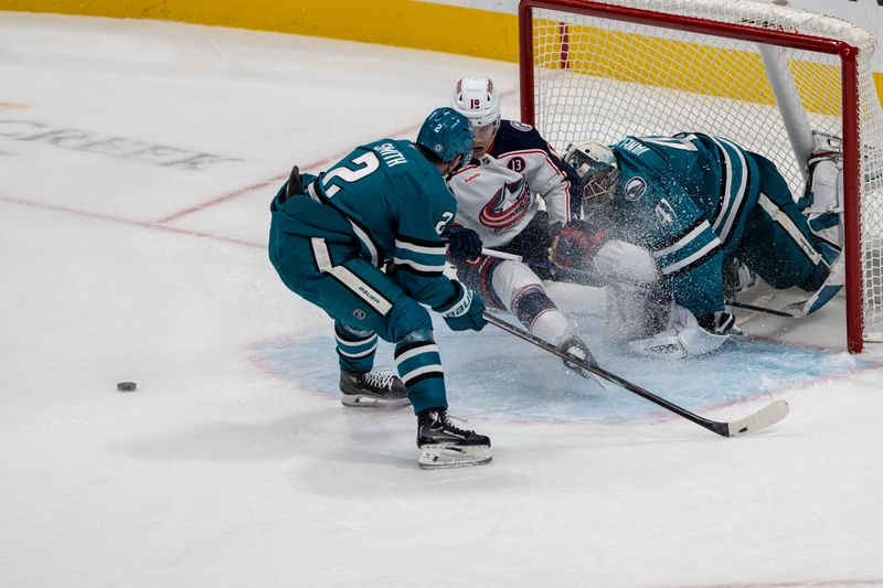 Nov 5, 2024; San Jose, California, USA;  after the save Columbus Blue Jackets center Adam Fantilli (19) collides with San Jose Sharks goaltender Vitek Vanecek (41) during overtime at SAP Center at San Jose. Mandatory Credit: Neville E. Guard-Imagn Images