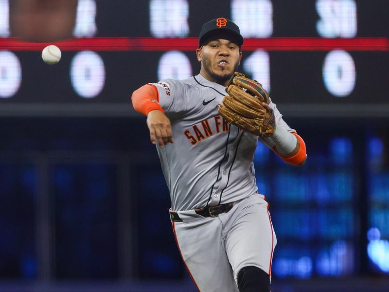 Apr 17, 2024; Miami, Florida, USA; San Francisco Giants second baseman Thairo Estrada (39) throws to first base and retires Miami Marlins second base Luis Arraez (not pictured) during the sixth inning at loanDepot Park. Mandatory Credit: Sam Navarro-USA TODAY Sports