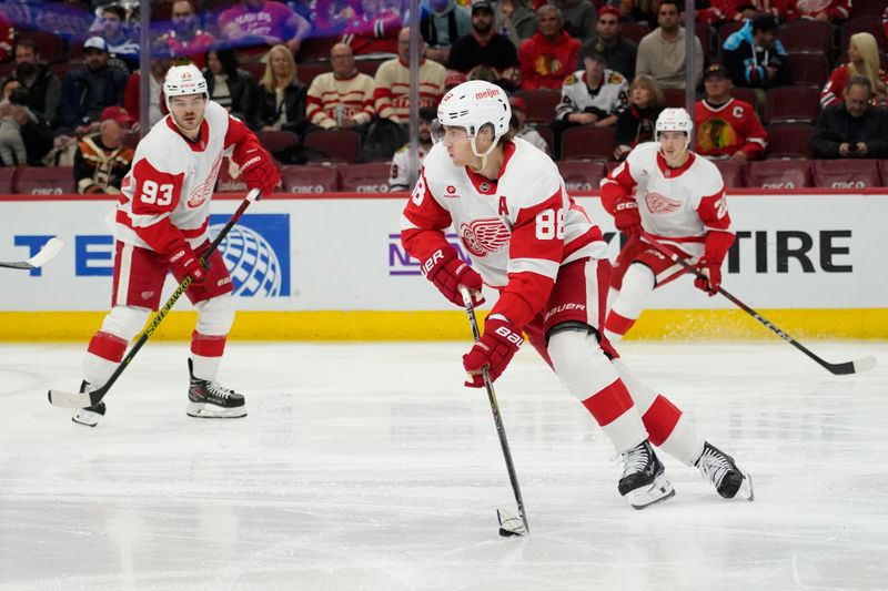 Nov 6, 2024; Chicago, Illinois, USA; Detroit Red Wings right wing Patrick Kane (88) moves the puck against the Chicago Blackhawks during the second period at United Center. Mandatory Credit: David Banks-Imagn Images