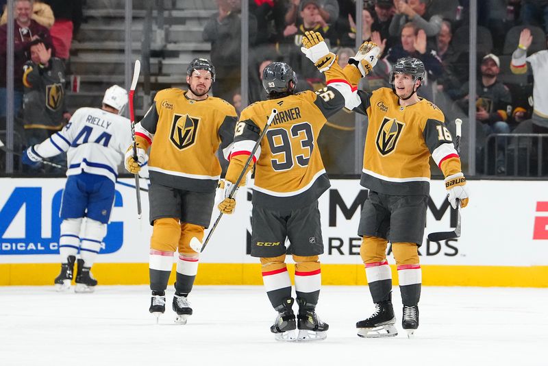 Jan 15, 2026; Las Vegas, Nevada, USA; Vegas Golden Knights right wing Pavel Dorofeyev (16) celebrates with right wing Mitch Marner (93) and center Tomas Hertl (48) after scoring a goal against the Toronto Maple Leafs during the first period at T-Mobile Arena. Mandatory Credit: Stephen R. Sylvanie-Imagn Images
