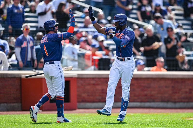 Jun 4, 2023; New York City, New York, USA; New York Mets right fielder Starling Marte (6) is greeted by New York Mets second baseman Jeff McNeil (1) after hitting a home run against the Toronto Blue Jays during the sixth inning at Citi Field. Mandatory Credit: John Jones-USA TODAY Sports