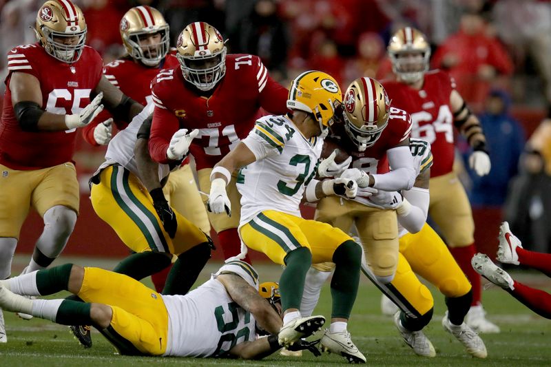 San Francisco 49ers wide receiver Deebo Samuel (19) runs during an NFL divisional round playoff football game against the Green Bay Packers Saturday, Jan. 20, 2024, in Santa Clara. (AP Photo/Scot Tucker)