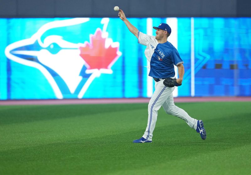 Jun 28, 2023; Toronto, Ontario, CAN; Toronto Blue Jays relief pitcher Erik Swanson (50) warms up during batting practice against the San Francisco Giants at Rogers Centre. Mandatory Credit: Nick Turchiaro-USA TODAY Sports