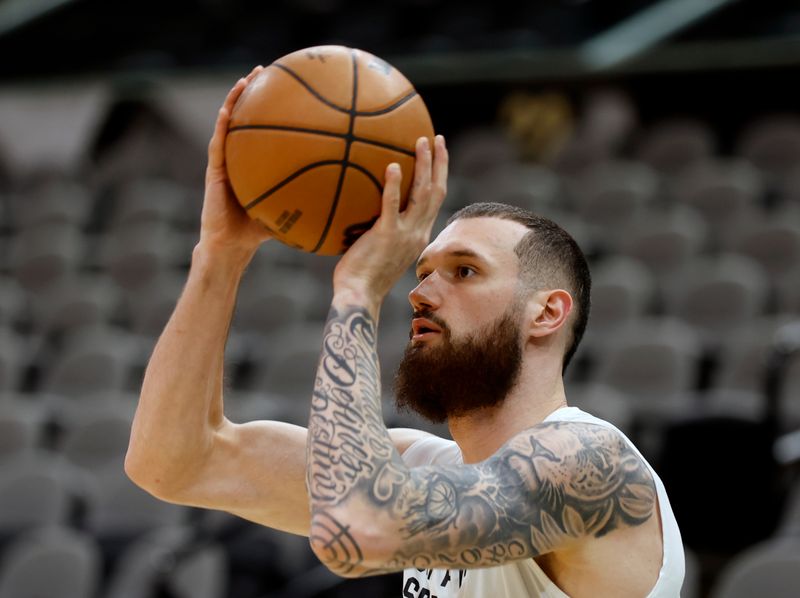 SAN ANTONIO, TX - FEBRUARY 3: Sandro Mamukelashvili #54 of the San Antonio Spurs takes warm up shots before their game against the Cleveland Cavaliers at Frost Bank Center on February 3, 2024 in San Antonio, Texas. NOTE TO USER: User expressly acknowledges and agrees that, by downloading and or using this photograph, User is consenting to terms and conditions of the Getty Images License Agreement. (Photo by Ronald Cortes/Getty Images)