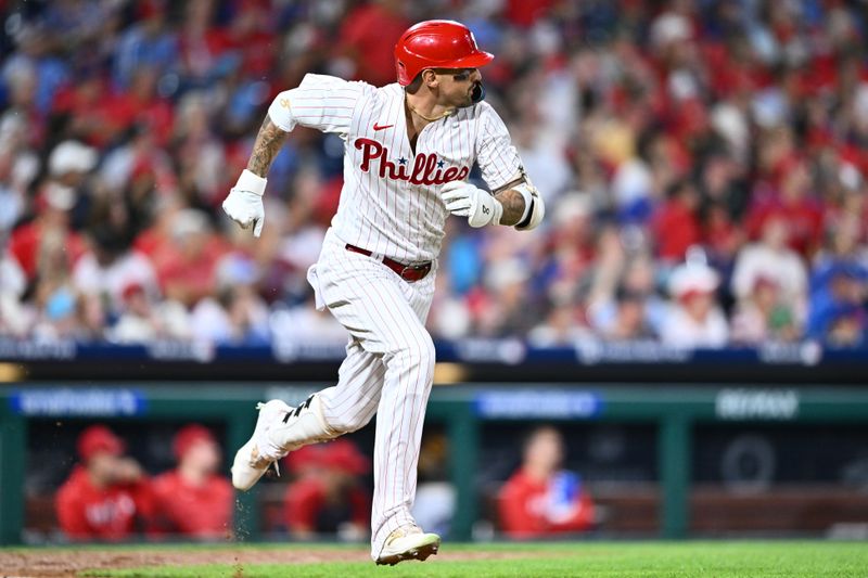 Aug 29, 2023; Philadelphia, Pennsylvania, USA; Philadelphia Phillies outfielder Nick Castellanos (8) advances to first after hitting a single against the Los Angeles Angels in the sixth inning at Citizens Bank Park. Mandatory Credit: Kyle Ross-USA TODAY Sports