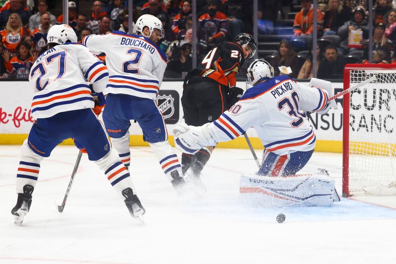 Feb 9, 2024; Anaheim, California, USA; Edmonton Oilers goaltender Calvin Pickard (30) makes a save against Anaheim Ducks center Bo Groulx (24) during the second period of a game at Honda Center. Mandatory Credit: Jessica Alcheh-USA TODAY Sports