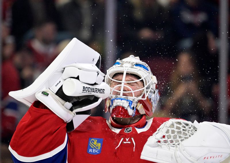 Dec 20, 2025; Montreal, Quebec, CAN; Montreal Canadiens goalie Jacob Fowler (32) takes a break during the third period of the game against the Pittsburgh Penguins at the Bell Centre. Mandatory Credit: Eric Bolte-Imagn Images