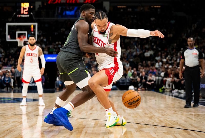 MINNEAPOLIS, MINNESOTA - APRIL 2: Anthony Edwards #5 of the Minnesota Timberwolves knocks the ball away as he defends Dillon Brooks #9 of the Houston Rockets in the second quarter of the game at Target Center on April 2, 2024 in Minneapolis, Minnesota. NOTE TO USER: User expressly acknowledges and agrees that, by downloading and or using this photograph, User is consenting to the terms and conditions of the Getty Images License Agreement. (Photo by Stephen Maturen/Getty Images)