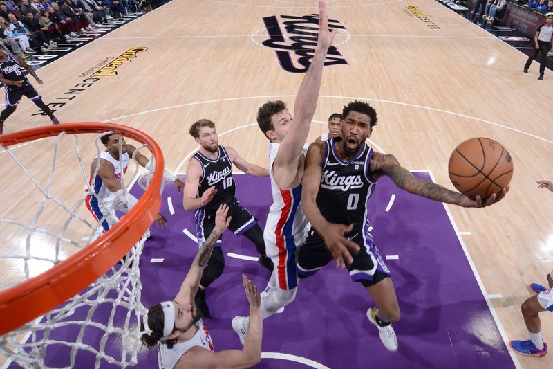 SACRAMENTO, CA - FEBRUARY 7: Malik Monk #0 of the Sacramento Kings drives to the basket during the game against the Detroit Pistons on February 7, 2024 at Golden 1 Center in Sacramento, California. NOTE TO USER: User expressly acknowledges and agrees that, by downloading and or using this Photograph, user is consenting to the terms and conditions of the Getty Images License Agreement. Mandatory Copyright Notice: Copyright 2024 NBAE (Photo by Rocky Widner/NBAE via Getty Images)