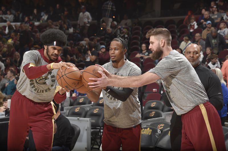 CLEVELAND, OH - NOVEMBER 8:  Jarrett Allen #31, Isaac Okoro #35 and Dean Wade #32 of the Cleveland Cavaliers before the game against the Golden State Warriors during a regular season game on November 8, 2024 at Rocket Mortgage FieldHouse in Cleveland, Ohio. NOTE TO USER: User expressly acknowledges and agrees that, by downloading and/or using this Photograph, user is consenting to the terms and conditions of the Getty Images License Agreement. Mandatory Copyright Notice: Copyright 2024 NBAE (Photo by David Liam Kyle/NBAE via Getty Images)