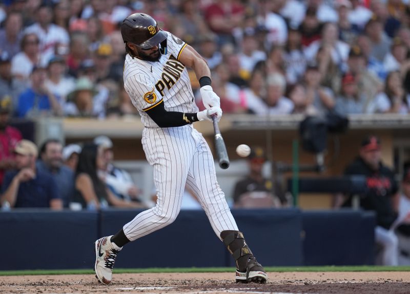 Aug 16, 2023; San Diego, California, USA; San Diego Padres right fielder Fernando Tatis Jr. (23) hits an RBI single during the third inning against the Baltimore Orioles at Petco Park. Mandatory Credit: Ray Acevedo-USA TODAY Sports