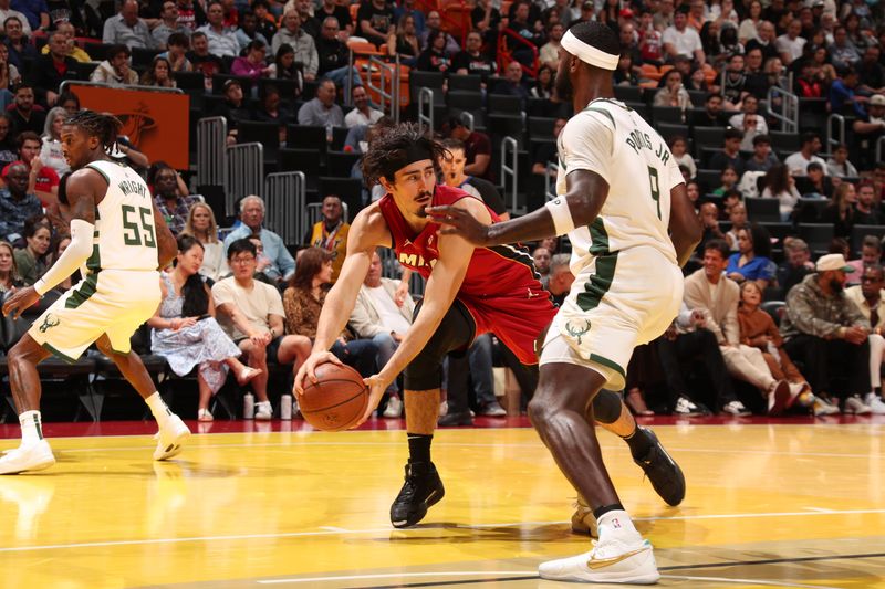 MIAMI, FL - NOVEMBER 26: Jaime Jaquez Jr. #11 of the Miami Heat handles the ball during the game against the Milwaukee Bucks during the Emirates NBA Cup game on November 26, 2024 at Kaseya Center in Miami, Florida. NOTE TO USER: User expressly acknowledges and agrees that, by downloading and or using this Photograph, user is consenting to the terms and conditions of the Getty Images License Agreement. Mandatory Copyright Notice: Copyright 2024 NBAE (Photo by Issac Baldizon/NBAE via Getty Images)