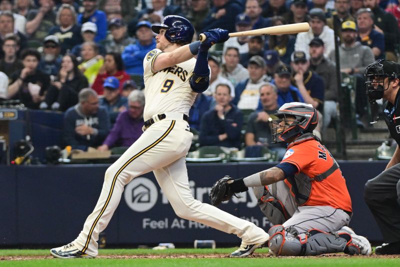 May 24, 2023; Milwaukee, Wisconsin, USA; Milwaukee Brewers right fielder Brian Anderson (9) hits a solo home run in the seventh inning as Houston Astros catcher Mart n Maldonado (15) watches at American Family Field. Mandatory Credit: Benny Sieu-USA TODAY Sports