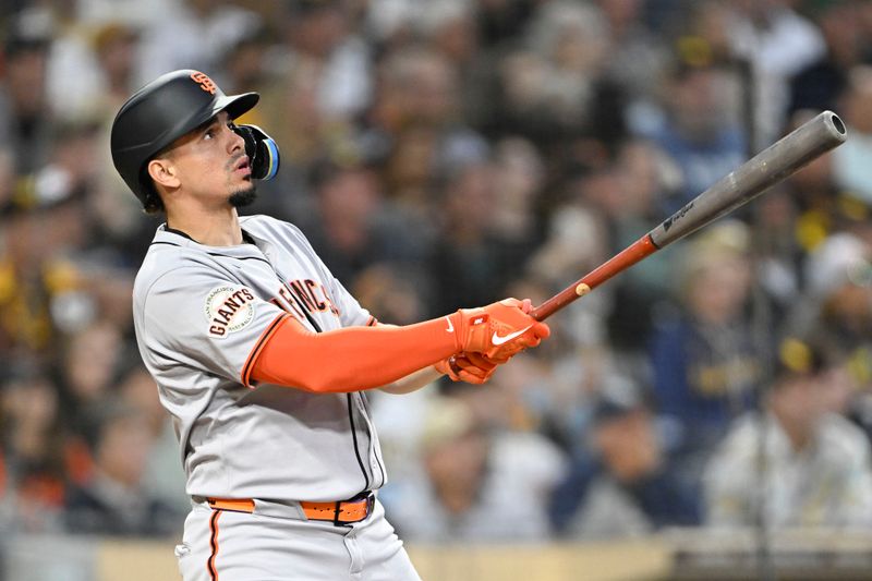 Apr 29, 2025; San Diego, California, USA; San Francisco Giants shortstop Willy Adames (2) hits a solo home run during the fourth inning against the San Diego Padres at Petco Park. Mandatory Credit: Denis Poroy-Imagn Images