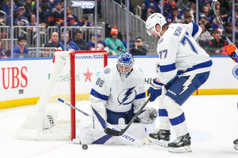 Feb 24, 2024; Elmont, New York, USA;  Tampa Bay Lightning goaltender Andrei Vasilevskiy (88) and defenseman Victor Hedman (77) defend the net in the second period against the New York Islanders at UBS Arena. Mandatory Credit: Wendell Cruz-USA TODAY Sports