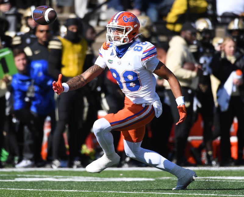 Nov 19, 2022; Nashville, Tennessee, USA; Florida Gators wide receiver Marcus Burke (88) loses control of the ball on a pass during the first half against the Vanderbilt Commodores at FirstBank Stadium. Mandatory Credit: Christopher Hanewinckel-USA TODAY Sports