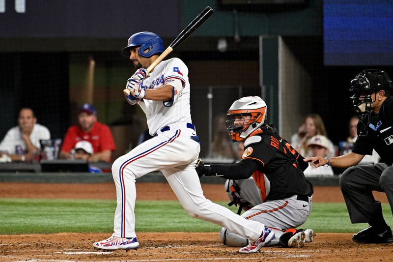 Oct 10, 2023; Arlington, Texas, USA; Texas Rangers second baseman Marcus Semien (2) hits a double in the second inning against the Baltimore Orioles during game three of the ALDS for the 2023 MLB playoffs at Globe Life Field. Mandatory Credit: Jerome Miron-USA TODAY Sports