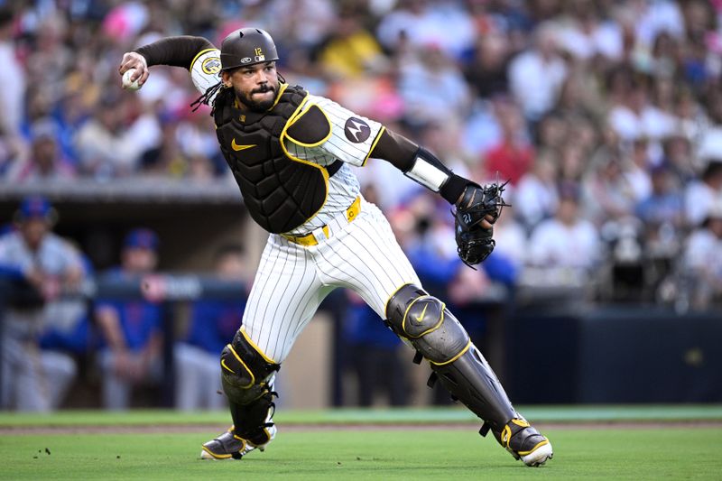 Aug 22, 2024; San Diego, California, USA; San Diego Padres catcher Luis Campusano (12) throws to first base during the second inning against the New York Mets at Petco Park. Mandatory Credit: Orlando Ramirez-USA TODAY Sports